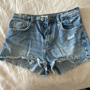 Ripped mid rise blue denim shorts